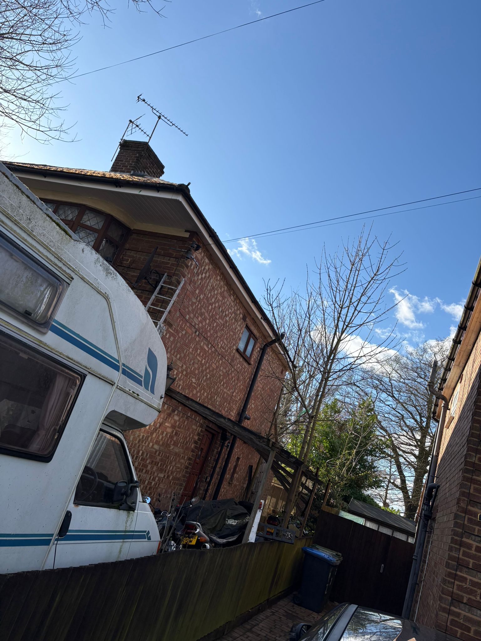 Side gable roofing and exterior works on a detached home