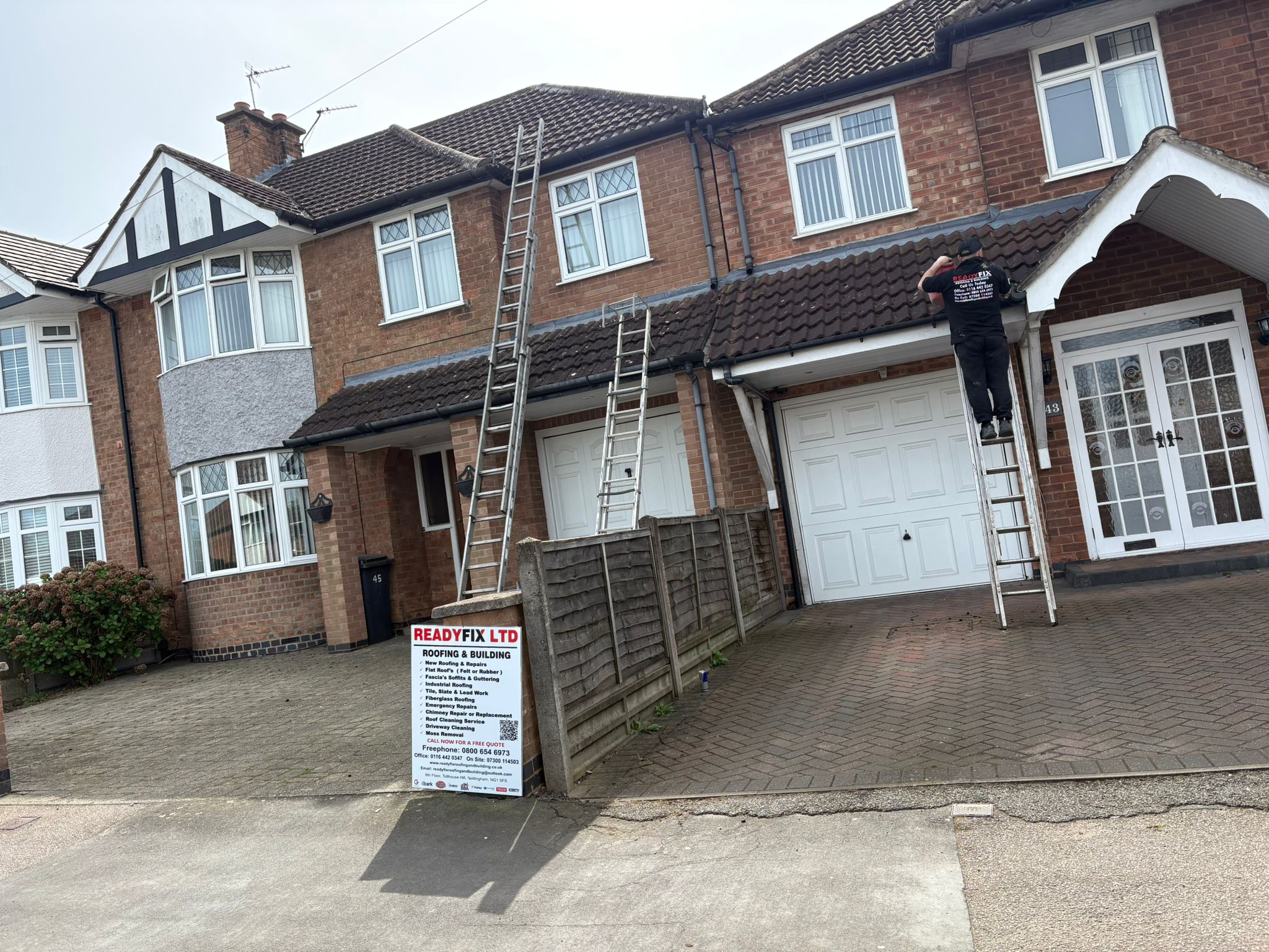 ReadyFix roofer on a ladder carrying out fascia and roofline work